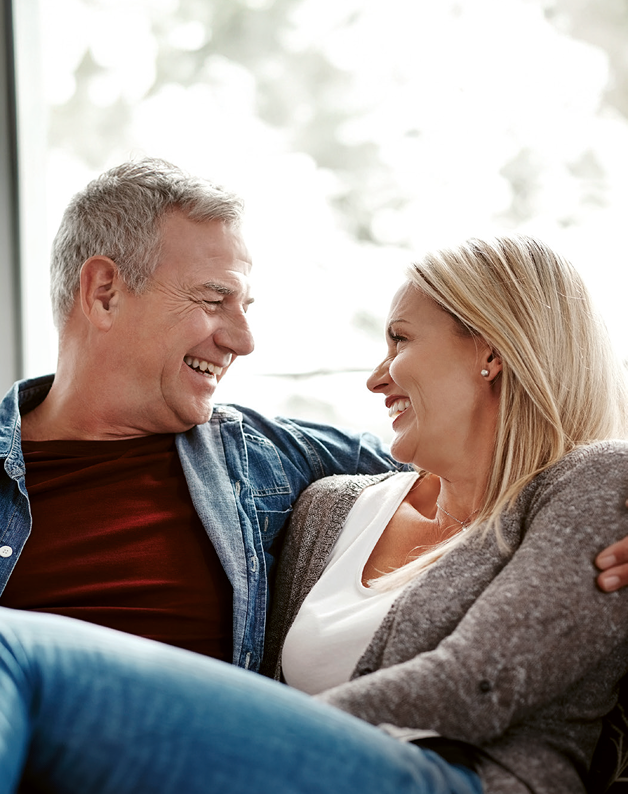 Shot of an affectionate mature couple relaxing together on the sofa at home